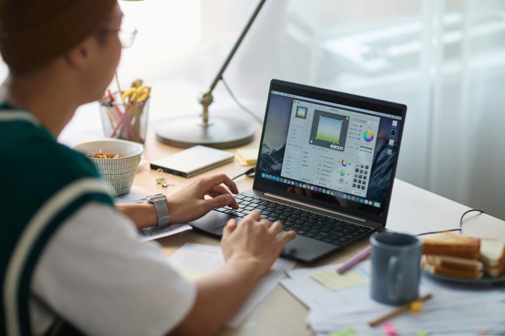 Man Working on Graphic Design Project at Desk